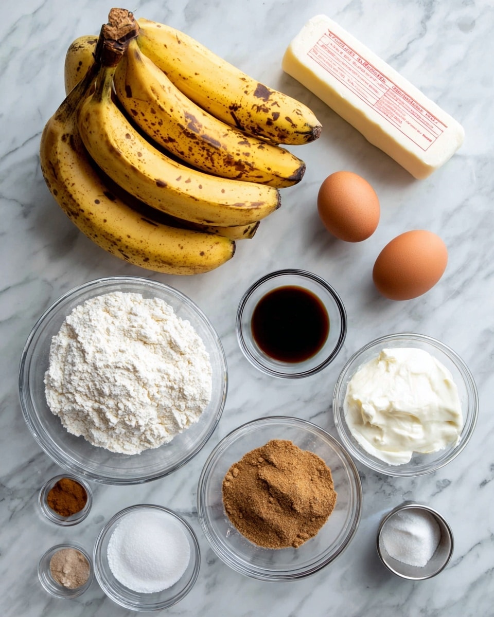 A cluster of five ripe, yellow bananas with brown spots sits in the top left corner on a white marbled surface. To the right, there is a white, rectangular stick of butter with red text. Below the butter, two brown eggs rest side by side directly on the surface. Below the eggs, a clear bowl holds thick white sour cream. Centrally placed is a large clear bowl filled with white flour that has a slightly lumpy texture. To the right of the large bowl, a small clear bowl contains dark vanilla extract. Below the large flour bowl, a medium clear bowl holds soft brown sugar with a crumbly texture. Near the bottom left of the image, three small clear bowls are arranged vertically, containing cinnamon powder, white salt, and baking powder respectively, and a small silver cup. The whole scene is on a bright white marbled surface with soft natural light coming from the top left, photo taken with an iphone --ar 4:5 --v 7