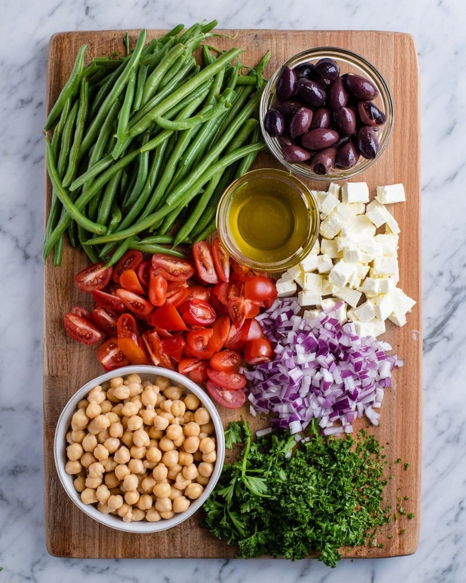 A wooden cutting board holds an arrangement of fresh ingredients: a large pile of bright green beans is placed at the top left, next to a small pile of dark purple sliced olives on the top right. Below the olives, there's a small clear bowl filled with golden dressing. Next to the green beans and olives, white chunks of soft cheese are placed. To the right bottom of the cheese, finely chopped purple onion is spread. At the bottom center, a white bowl is filled with light beige chickpeas, and to its left, a pile of halved red grape tomatoes rests near a small bunch of fresh green parsley. The whole setup is on a white marbled surface photo taken with an iphone --ar 4:5 --v 7