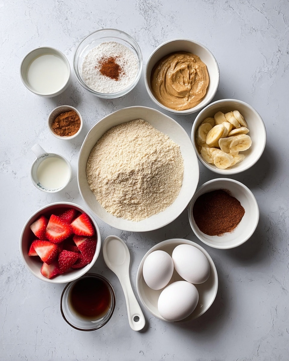 The image shows several white bowls and a small white measuring spoon on a white marbled surface, each holding different ingredients. The main large bowl in the center contains a light beige powder, likely almond flour. Surrounding it are other bowls: one with a white powder mix including cinnamon on top, one with a smooth light brown mixture, one with mashed bananas in a light brownish tone, another filled with bright red sliced strawberries, and a smaller bowl with a dark brown powder resembling coconut sugar. Three whole white eggs are placed together near the bottom. A small bowl holds a dark liquid, and another has a white liquid, possibly milk. A white measuring spoon containing a clear light liquid is at the left side. The setup is neatly arranged with good lighting showing textures clearly photo taken with an iphone --ar 4:5 --v 7