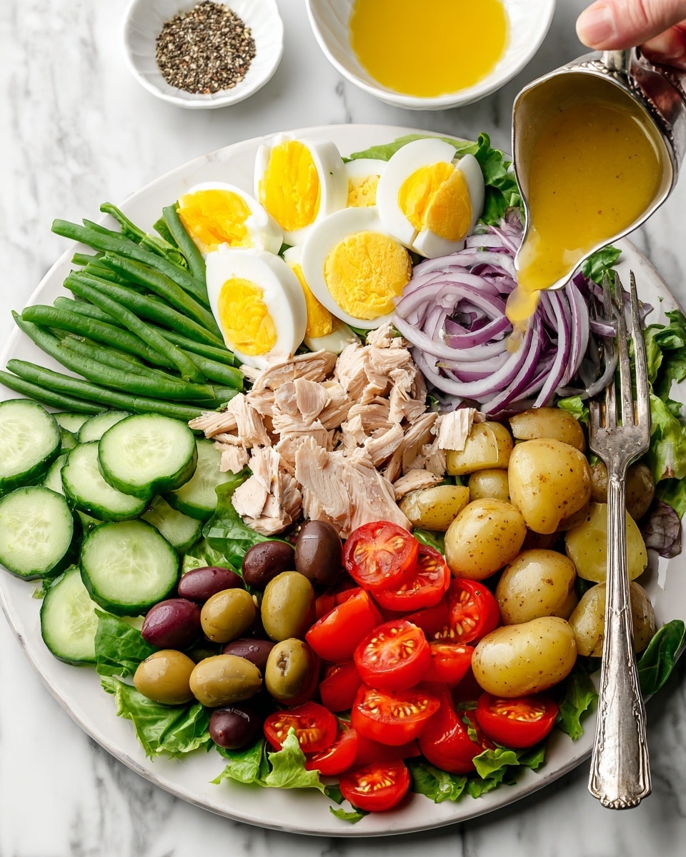 A white plate is filled with a colorful salad arranged in sections. Starting from the bottom left, there are thin slices of cucumber in a neat row, next to thin rings of purple onion. Above, there are bright red cherry tomato halves on green leafy lettuce. In the center, there is a pile of sliced light beige cooked turkey or chicken. Above it, there are several halved boiled eggs showing soft, yellow yolks. To the right, fresh green beans are stacked beside small yellow and brown halved potatoes. Below the potatoes, there are green and dark red olives mixed together. A silver spoon held by a woman's hand is pouring a golden dressing over the potatoes and beans. In the background, there are two white bowls, one with a yellow dressing and the other with ground black pepper, all set on a white marbled surface. Photo taken with an iphone --ar 4:5 --v 7