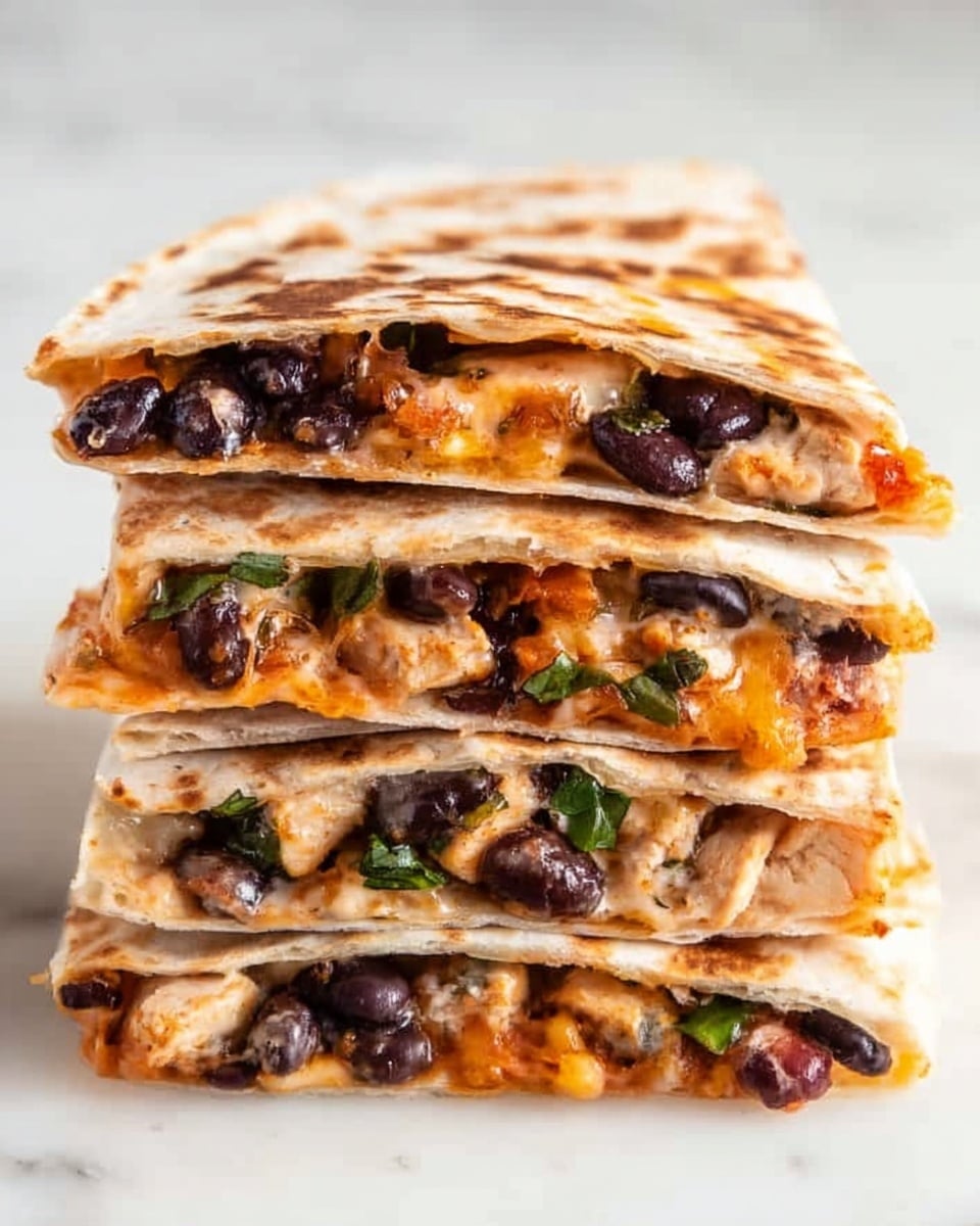 The image shows four folded pieces of quesadilla layered with a toasted light brown and slightly spotted white tortilla on the outside. Inside, there are visible layers including melted orange cheese, small black beans, and bits of green and white vegetables, creating a colorful mix. The quesadillas are placed on white parchment paper, resting on a white marbled surface with a blurred green garnish in the background. The close-up shot highlights the soft, textured filling and the crisp edges of the tortillas, giving a warm, fresh look. Photo taken with an iphone --ar 4:5 --v 7