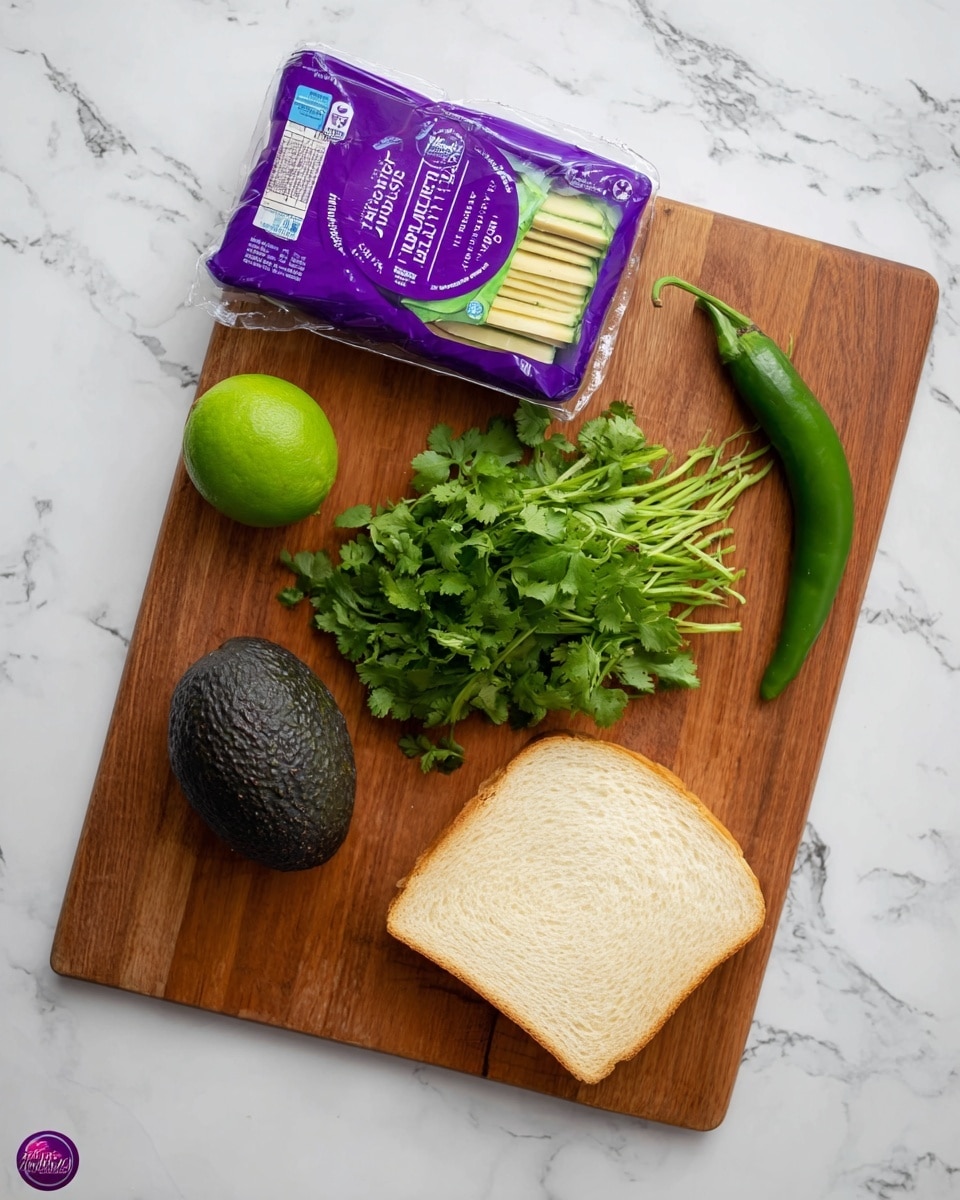 A wooden cutting board rests on a white marbled surface, holding a small bundle of fresh green cilantro positioned at the center bottom of the board. To the left of the cilantro, there is a whole lime with a rich green color and a whole dark green avocado with a textured skin, both near the left side of the board. At the top left corner lies a purple package of sliced cheese with a clear window showing the pale yellow cheese slices inside. On the right side of the board is a single slice of white bread. A long, thin green chili pepper is placed diagonally near the cilantro's right side, close to the right edge of the board. No hands are present in the image. photo taken with an iphone --ar 4:5 --v 7