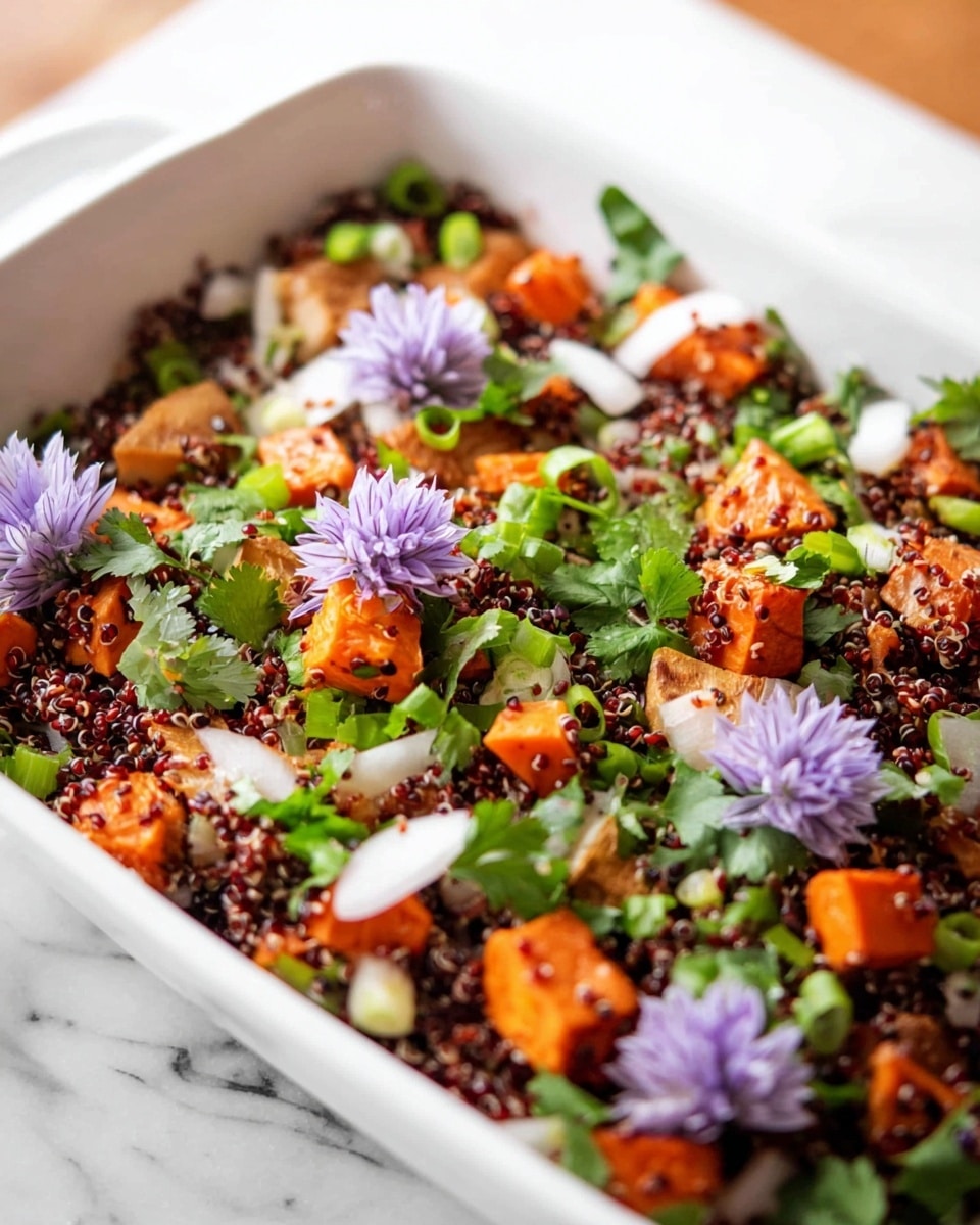 A white rectangular dish filled with a layered salad, starting with a base of dark red quinoa, topped with bright orange roasted sweet potato cubes, and mixed with white onion slices and green chopped scallions. The salad is sprinkled with fresh green cilantro leaves and garnished with light purple edible flowers placed evenly on top. The ingredients have a mix of soft and slightly crunchy textures, with the colors of orange, green, purple, and white standing out against the red quinoa, all set on a white marbled surface. Photo taken with an iphone --ar 4:5 --v 7