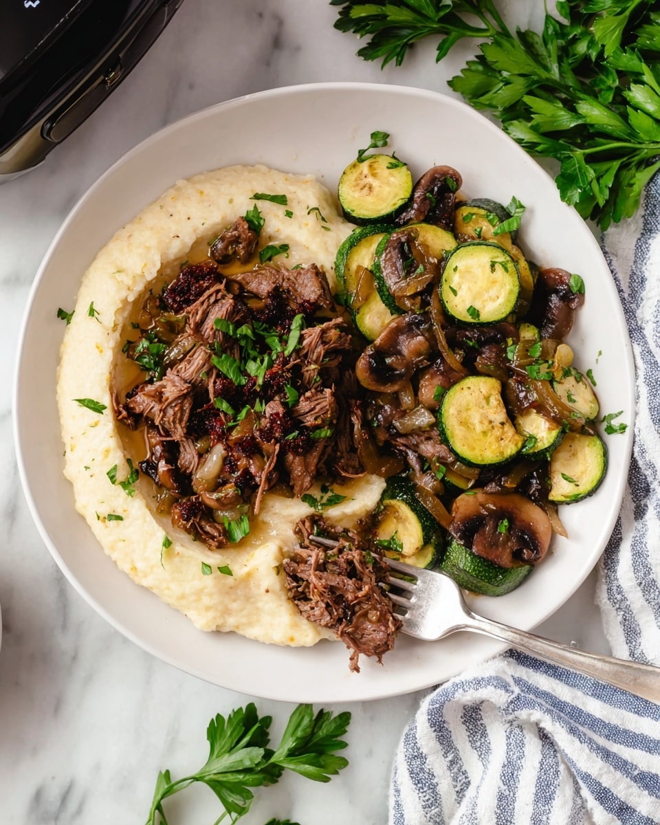 A white plate holds three layers of food arranged side by side. On the left is a creamy beige puree with a smooth, slightly textured surface spreading in a broad round layer. On top and spreading into the middle is a layer of shredded, cooked dark brown meat mixed with small bits of caramelized onions and green parsley leaves scattered throughout. To the right is a pile of sautéed vegetables with thick round slices of green zucchini, whole dark brown mushrooms, and soft caramelized onion strips, all garnished with more chopped parsley. A silver fork rests on the plate, holding a bite of meat. The setting includes a white marbled surface with fresh green parsley nearby and a striped white and blue cloth visible at the bottom right corner, photo taken with an iphone --ar 4:5 --v 7
