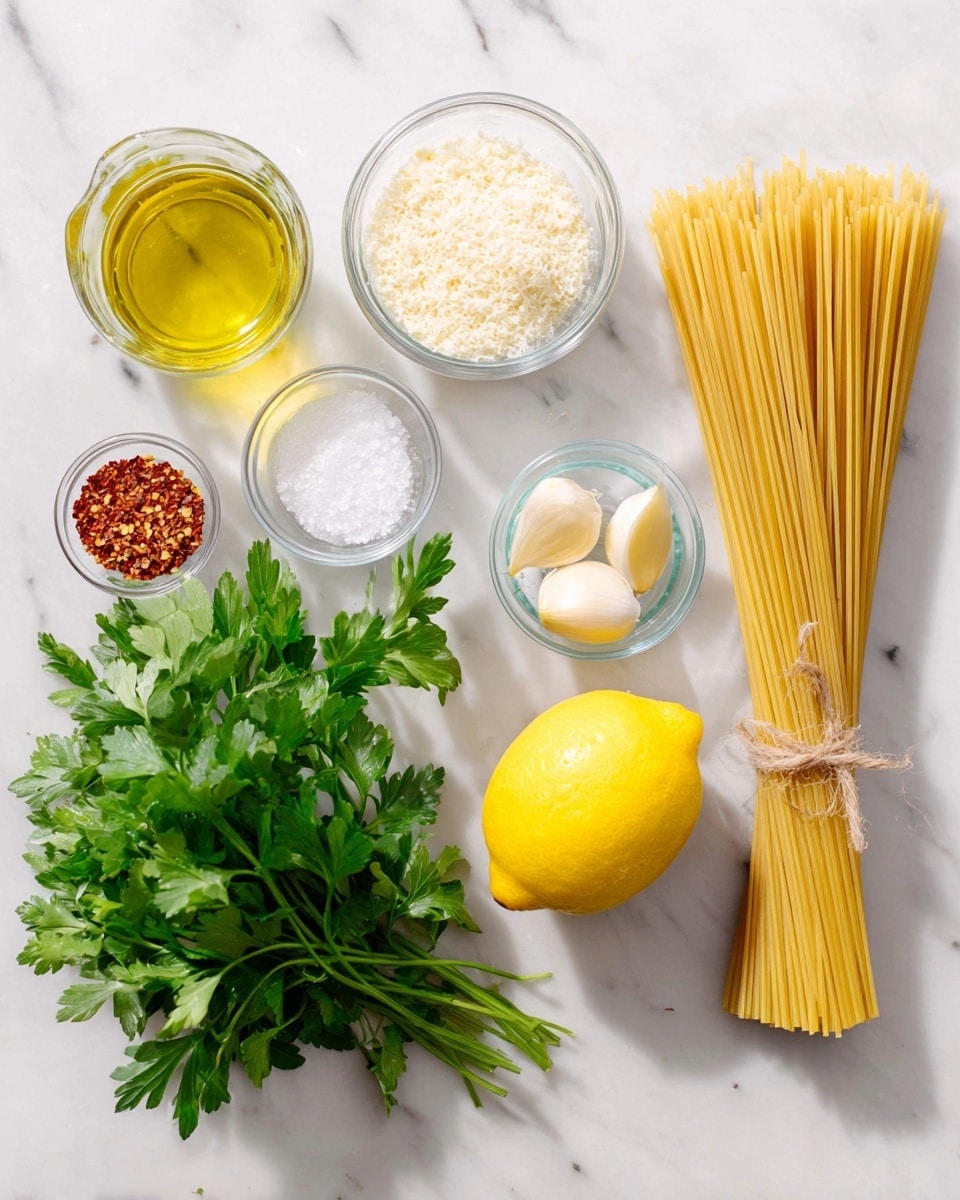 A top view of cooking ingredients arranged neatly on a white marbled surface, showing a bundle of dry spaghetti tied with string on the right, a whole bright yellow lemon below it, and a small glass bowl of coarse salt nearby. To the left are a small glass bottle of light olive oil, a bunch of fresh green parsley with detailed leaves, a bowl of grated parmesan cheese, three cloves of garlic in a clear bowl, and a tiny bowl of red chili flakes. The items are all spaced out clearly with natural light casting soft shadows, creating a fresh and clean look photo taken with an iphone --ar 4:5 --v 7