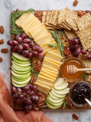 Fruit and Cheese Platter with Nuts, Crackers, and Garnishes Recipe