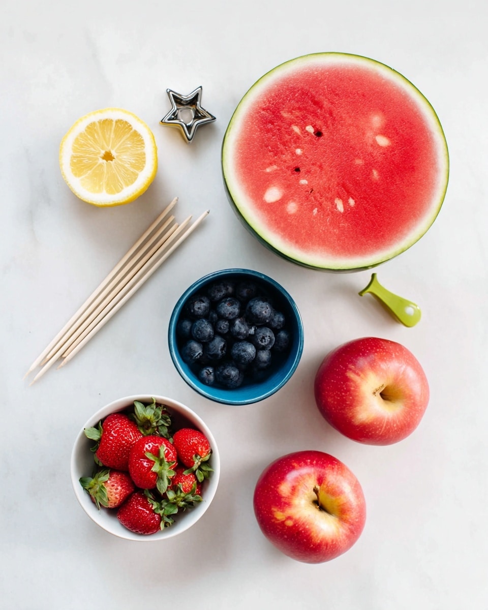 The image shows a flat lay of fresh fruit and cooking tools on a white marbled surface. At the top right is a large round slice of watermelon with a green rind and bright red inside with seeds. Below and left of it is a whole lemon slice showing its yellow flesh. Below the lemon are two red apples with smooth skin. To the bottom left is a white bowl filled with red strawberries with green leaves. Above this bowl to the center is a blue bowl full of shiny dark blueberries. To the top left are six light wooden skewers placed neatly next to a small green vegetable peeler and a metal star-shaped cookie cutter. The clean arrangement and bright colors of the fruit stand out sharply against the white marbled background. photo taken with an iphone --ar 4:5 --v 7