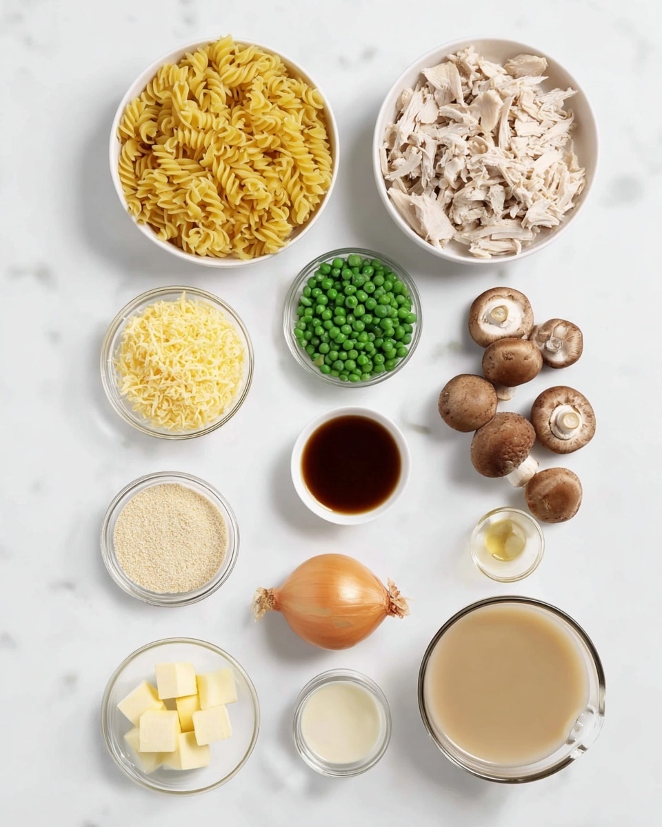 The image shows an overhead view of clear white bowls and small glass containers arranged neatly on a white marbled surface. At the top left is a bowl filled with cooked yellow rotini pasta, and to its right is a bowl with shredded light beige cooked chicken. Below the pasta bowl, a smaller bowl holds bright green peas, and next to it, a tiny bowl contains shredded pale yellow cheese. Near the center, there is a whole light brown onion and a couple of cloves of garlic beside it. To the right, a small group of brown mushrooms lies close together. Further down, a small glass container holds a dark amber liquid, likely soy sauce, and beside it is a small pile of light yellow butter cubes in a clear bowl. Next to the butter sits a tiny glass container with a creamy pale beige mustard sauce. Below these, a small bowl contains light beige breadcrumbs, and next to it, a white bowl contains creamy white milk. At the bottom right is a glass cup filled with light brown broth. photo taken with an iphone --ar 4:5 --v 7