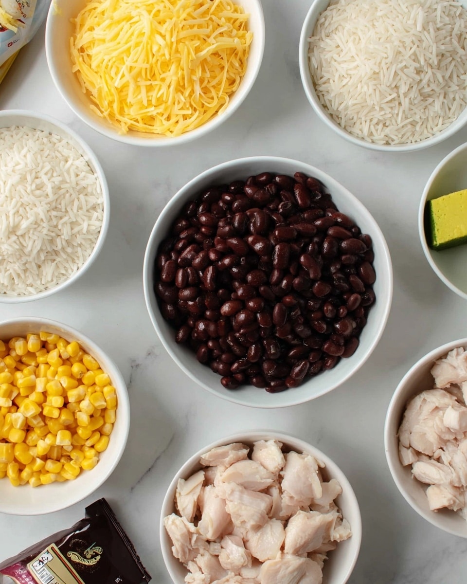 The image shows several white bowls arranged on a white marbled surface, each filled with different ingredients. In the center, there is a white bowl filled with shiny dark brown beans. Surrounding it are bowls with pale yellow shredded cheese, bright yellow corn kernels, and uncooked light beige chicken pieces. To the side, there is another bowl with long grains of white rice, and a small white dish holding a yellow-green bouillon cube. A package with a dark label is partially visible in the corner. The overall scene is clean and bright. photo taken with an iphone --ar 4:5 --v 7
