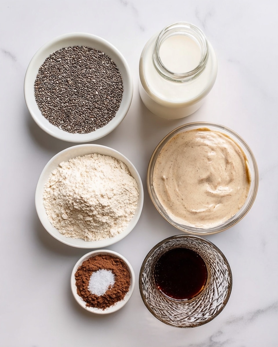 The image shows six separate containers arranged on a white marbled surface, each holding a different ingredient. At the top center is a glass bottle filled with white milk. To its left, a white bowl holds many small black chia seeds with a slightly shiny texture. To the right of the bottle, a clear glass bowl contains a smooth, creamy beige substance with tiny specks. Below these, on the left side, a small clear bowl holds fine dark brown powder. In the center at the bottom, a white bowl contains beige flour with a small sprinkle of white salt on top. On the right bottom, a textured clear glass holds a dark liquid. Photo taken with an iphone --ar 4:5 --v 7