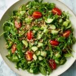 Warm Vegan Arugula & Grain Bowls with Grape Tomatoes, Cashews & Sherry Vinaigrette Recipe