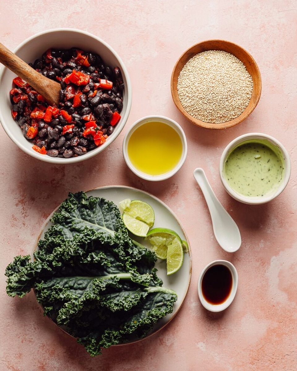 The image shows a white bowl filled with a mix of black beans and red diced peppers, with a wooden spoon resting inside. Next to it, a white plate holds fresh dark green kale leaves with curly edges alongside lime wedges and a small white bowl filled with yellow liquid, likely oil. Above the plate is a small wooden bowl filled with pale, round quinoa seeds. To the right of the quinoa is a white bowl with a creamy green sauce and a white spoon inside. Above the kale and near the top edge is a small spoon with a dark liquid on it. The items are all placed on a soft pink surface with subtle texture. Photo taken with an iphone --ar 4:5 --v 7