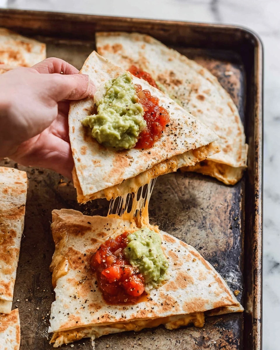 The image shows a close-up of a quesadilla being picked up by a woman's hand from a baking tray with a dark worn texture. Each quesadilla is folded in half, creating two layers of light beige tortilla with a slightly toasted pattern. Inside, gooey melted cheese stretches from the tray to the piece held, with a golden, creamy sauce mixed in. On top of each quesadilla piece, there are two dollops of toppings: a bright red salsa and a pale green guacamole, both sprinkled with black pepper. The setup is on a white marbled surface with subtle veins in the background. photo taken with an iphone --ar 4:5 --v 7