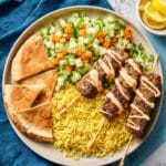 Spiced Beef Skewers with Rice Bowls, Tomato Cucumber Salad, Lemon Hummus & Toasted Pitas Recipe