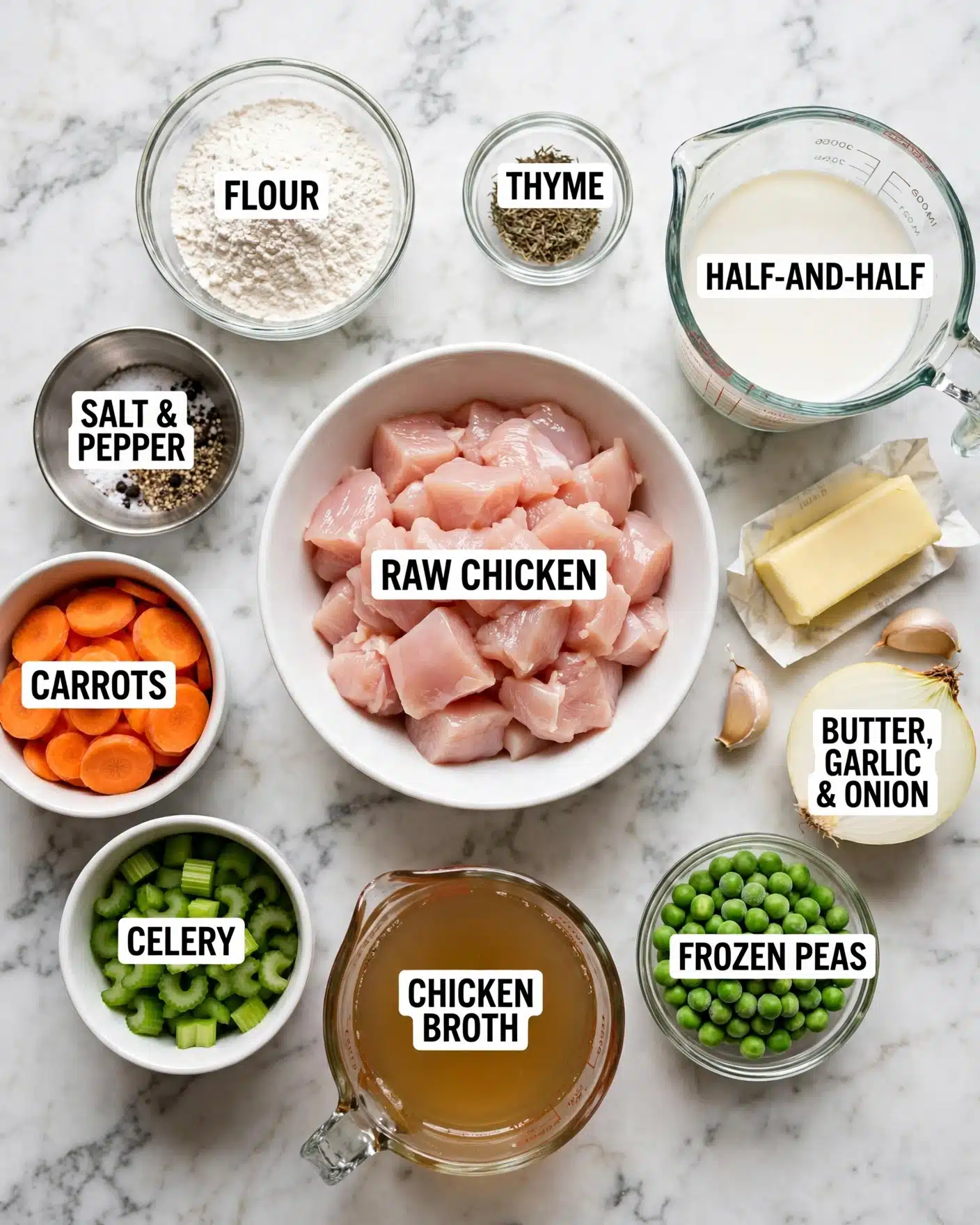 A white bowl in the center filled with raw pale pink chicken chunks is surrounded by smaller clear glass bowls and containers holding different ingredients arranged on a white marbled surface. Clockwise from the top left, there is a small clear bowl with white flour, a tiny clear bowl with dried thyme leaves, a glass measuring cup with white half-and-half liquid, a stick of light yellow butter and two cloves of beige garlic next to a half white onion, a small clear glass bowl full of bright green frozen peas, a glass measuring cup filled with light amber chicken broth, a white cup with dark green celery pieces, and another white cup filled with sliced vibrant orange carrots. In between is a small metallic bowl containing salt and pepper. Each ingredient is labeled clearly with bold text on white background. The photo taken with an iphone --ar 4:5 --v 7